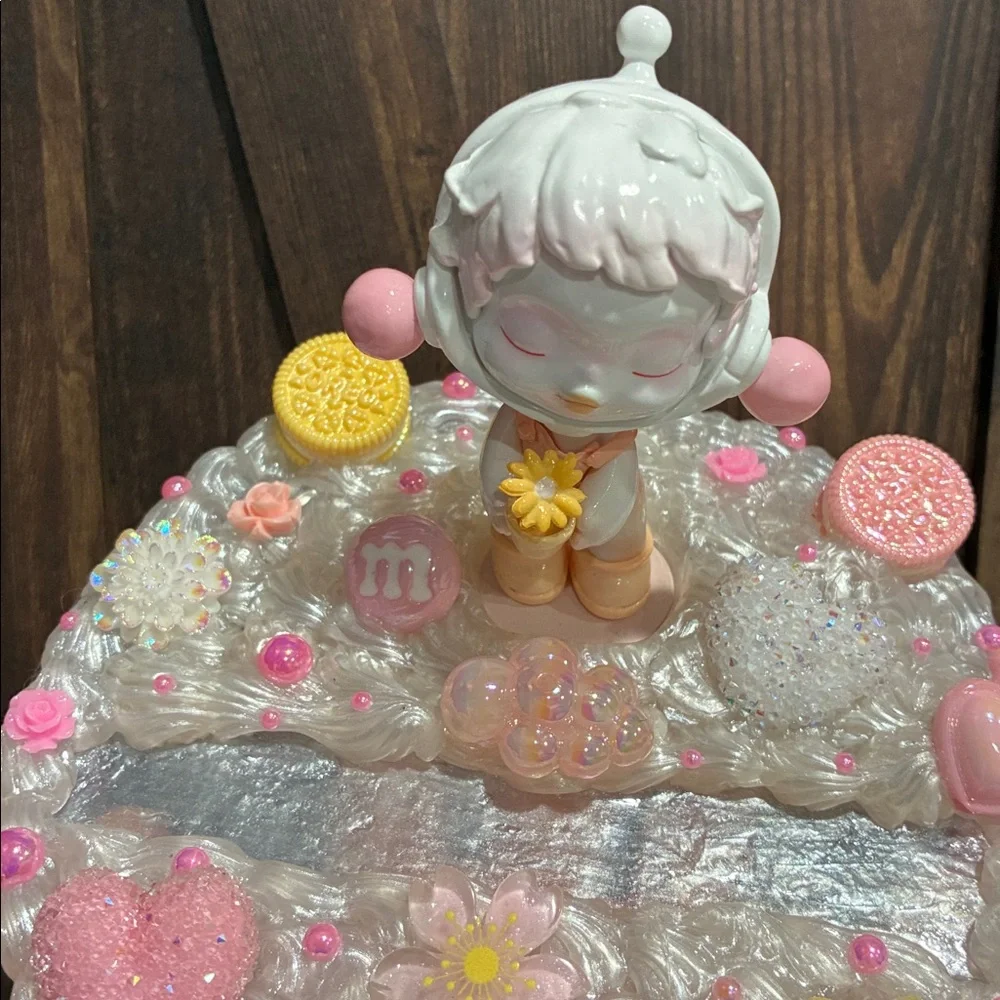 Charming Figurine with Candy and Floral Details